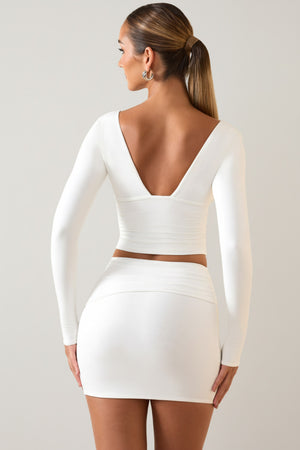 Oh Polly's Priscilla wearing the Aliz Mini Skirt in White Modal fabric perfect for rooftop parties