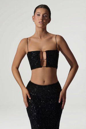 Oh Polly's Anna wearing the Ariana Full Top in Black Micro Sequin fabric perfect for a holiday event