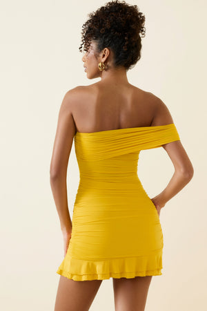 Oh Polly's Duda wearing the Arielle Mini Dress in Golden Yellow fabric perfect for beachside brunch dates