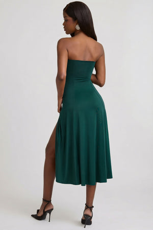 Oh Polly's Sevah wearing the Briona Midaxi Dress in Emerald Green Jersey fabric perfect for wedding guest looks