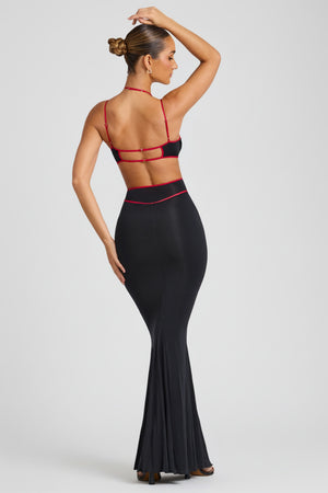 Oh Polly's Tori wearing the Bella Gown Length Dress in Black Sheer Jersey fabric perfect for a chic fashion event