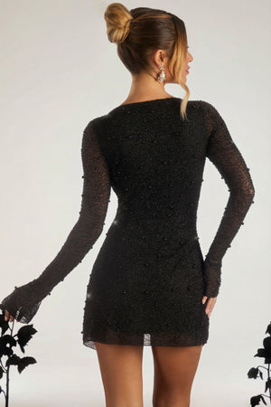 Oh Polly's Sierra Skye wearing the Chelsea Mini Dress in Black Embellished fabric perfect for cocktail parties