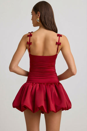 Oh Polly's Anna wearing the Cirilla Mini Dress in True Red Satin Jersey fabric perfect for a night out dancing