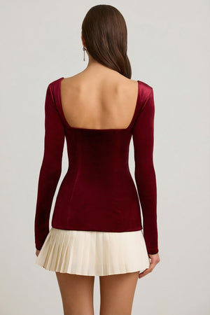 Oh Polly's Anna wearing the Darline Mini Dress in Wine Red Velvet fabric perfect for romantic dinners