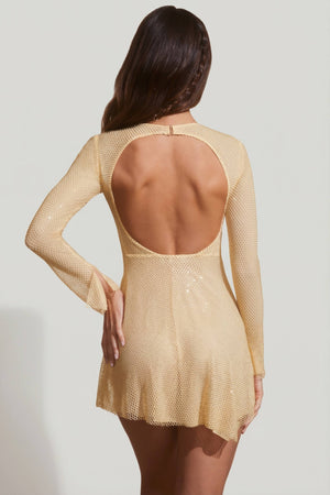 Oh Polly's Lini wearing the Dixie Mini Dress in Gold Rhinestone fabric perfect for a night out