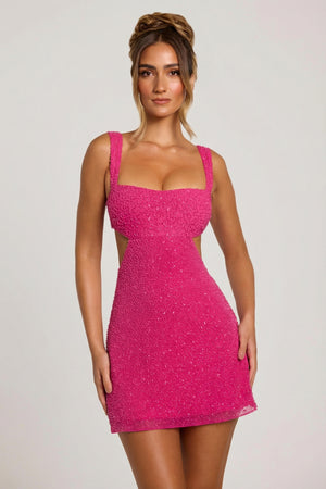 Oh Polly's Priscilla wearing the Emilion Mini Dress in Fuchsia Embellished fabric perfect for summer parties