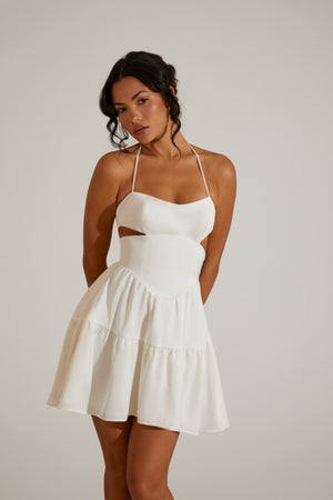 Oh Polly's Cenit wearing the Fleur Mini Dress in White Satin fabric perfect for romantic date nights