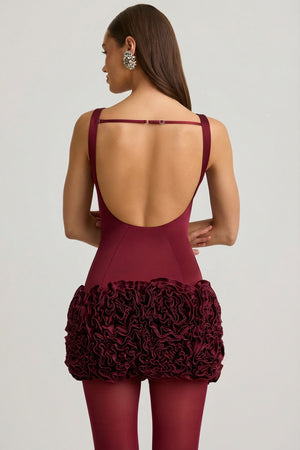 Oh Polly's Anna wearing the Florrie Mini Dress in Wine Red Satin fabric perfect for a holiday party night