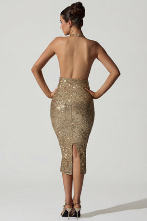 Oh Polly's Anna wearing the Harlyn Midi Dress in Gold Micro Sequin fabric perfect for holiday parties