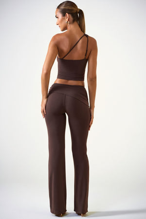Oh Polly's Priscilla wearing the Hollis Trousers in Chocolate Brown Modal fabric perfect for a night out