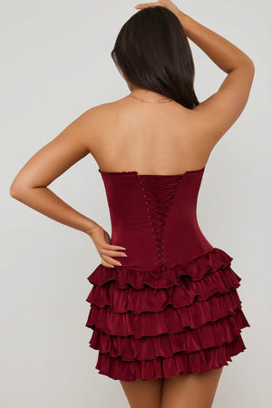 Oh Polly's Ella wearing the Juliet Mini Dress in Berry Red Satin fabric perfect for a night out dancing