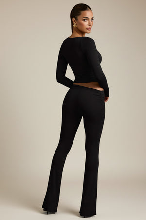 Modal Asymmetric-Waist Flared Trousers in Black