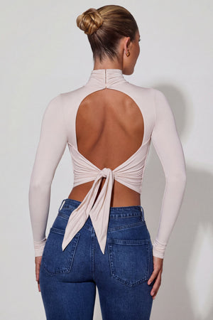 Oh Polly's Sierra Skye wearing the Karita Full Top in Ivory Slinky Jersey fabric perfect for rooftop parties