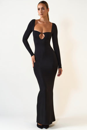 Oh Polly's Priscilla wearing the Luana Maxi Dress in Black Modal fabric perfect for luxury holiday dinners