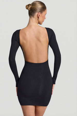 Oh Polly's Rona wearing the Lyla Mini Dress in Black Modal fabric perfect for birthday celebrations