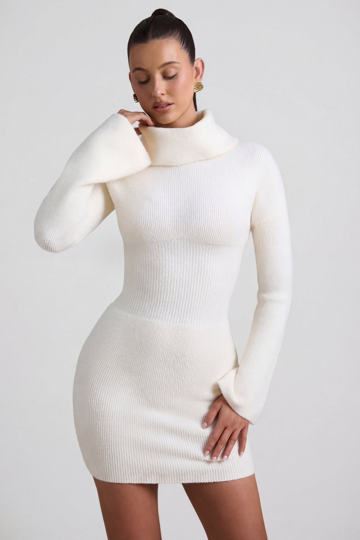 Oh Polly's Sarah wearing the Marta Mini Dress in Ivory Knitwear fabric perfect for city shopping trips