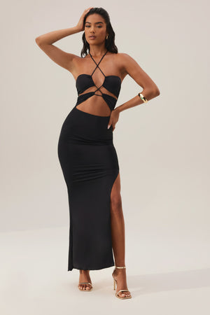 Oh Polly's Yarelis wearing the Oceane Maxi Dress in Black Slinky fabric perfect for cocktail parties