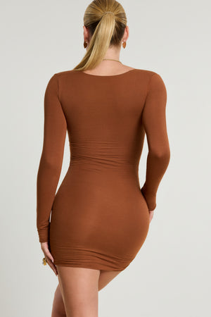 Oh Polly's Kiele wearing the Perrie Mini Dress in Chestnut Brown Modal fabric perfect for cocktail party looks