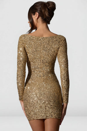 Oh Polly's Anna wearing the Sephina Mini Dress in Gold Micro Sequin fabric perfect for a night out