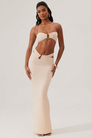 Oh Polly's Yarelis wearing the Sylas Maxi Skirt in Ivory Slinky fabric perfect for summer garden parties