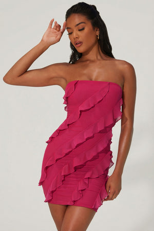 Oh Polly's Yarelis wearing the Tatiana Mini Dress in Fuchsia Mesh fabric perfect for summer parties