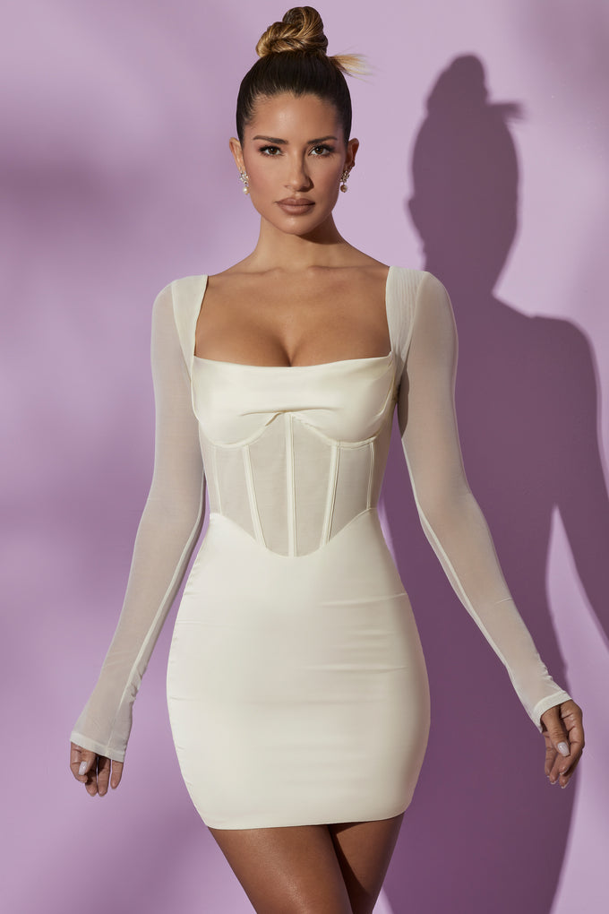 Sukienka mini z długim rękawem i siatkowym gorsetem w kolorze białym