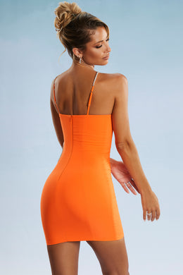 Asymetryczna sukienka mini z wycięciem w kolorze pomarańczowym