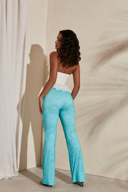 Back view of Flare trousers in teal print