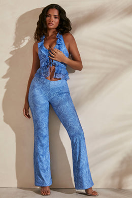 Flare trousers in blue print with matching ruffle crop top.