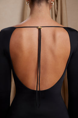 Mini-robe trapèze découpée à manches longues en noir