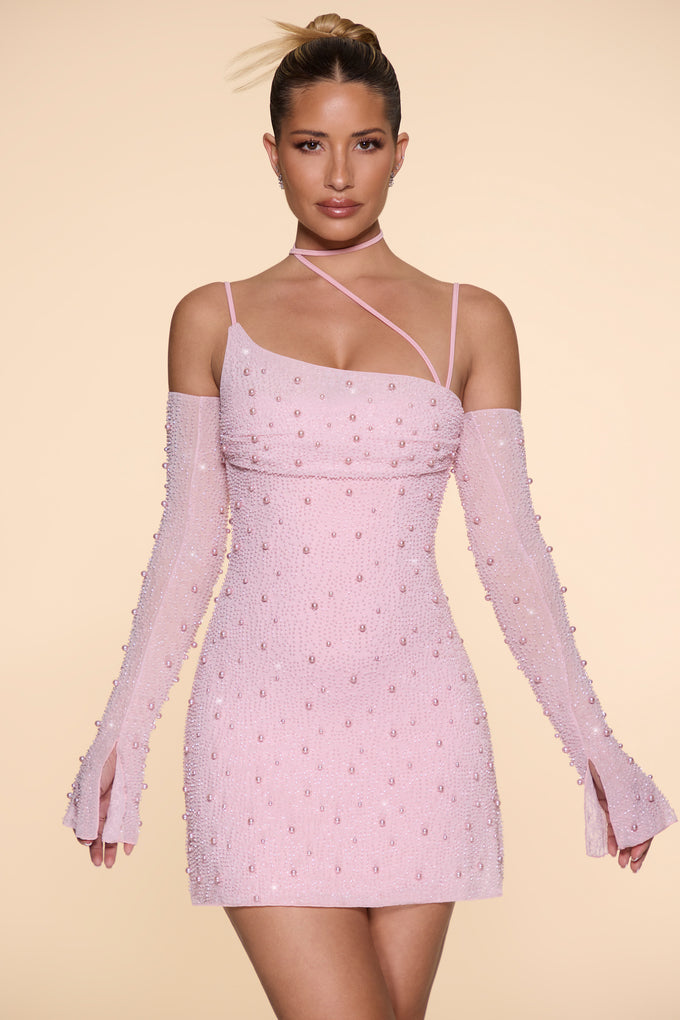 Ozdobiona asymetryczna sukienka mini z gorsetem w kolorze różu