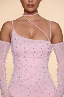 Ozdobiona asymetryczna sukienka mini z gorsetem w kolorze różu