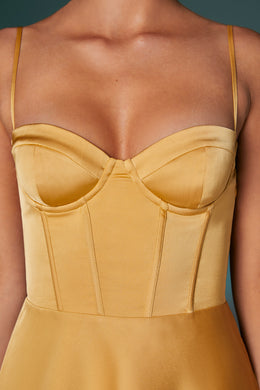 Mini-robe corset à ourlet asymétrique en or