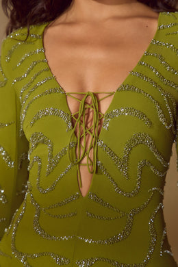 Koronkowa sukienka mini z długim rękawem w kolorze oliwkowym