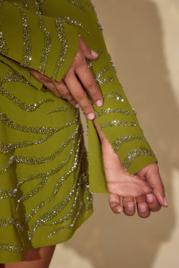 Koronkowa sukienka mini z długim rękawem w kolorze oliwkowym