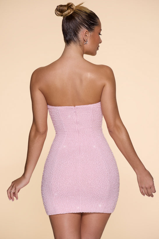 Ozdobna sukienka mini bez ramiączek z dekoltem w kolorze różowym