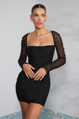 Mini-robe corset ornée à manches longues en noir