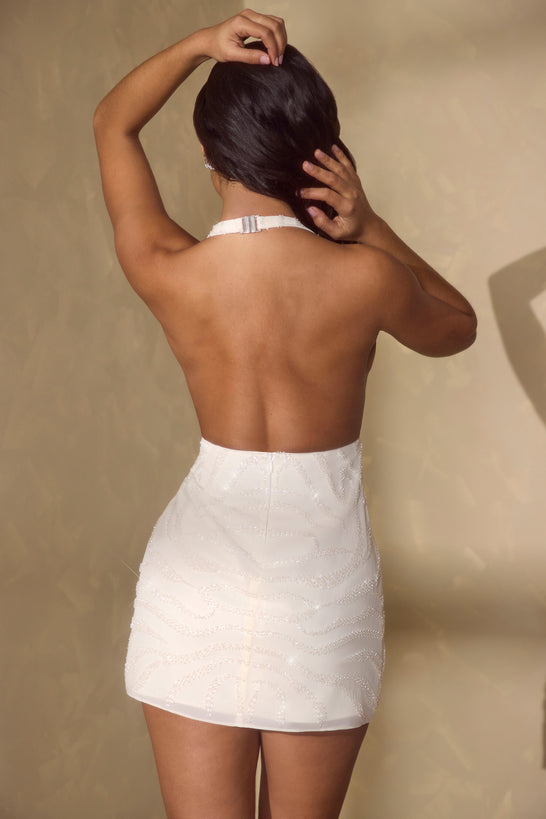 Kopertowa mini sukienka bez rękawów w kolorze złamanej bieli