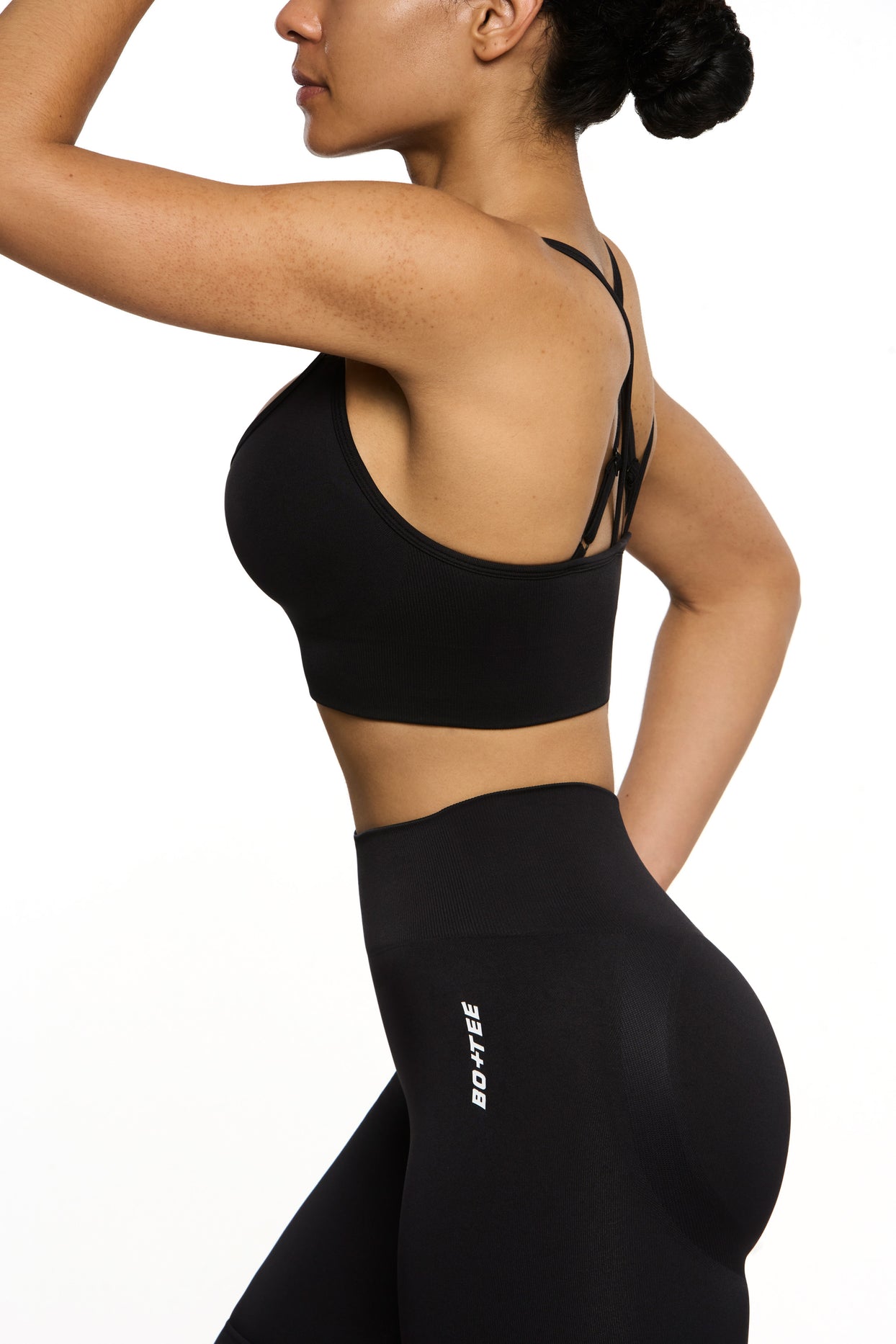 Side view of Seamless Strappy Sports Bra in Black