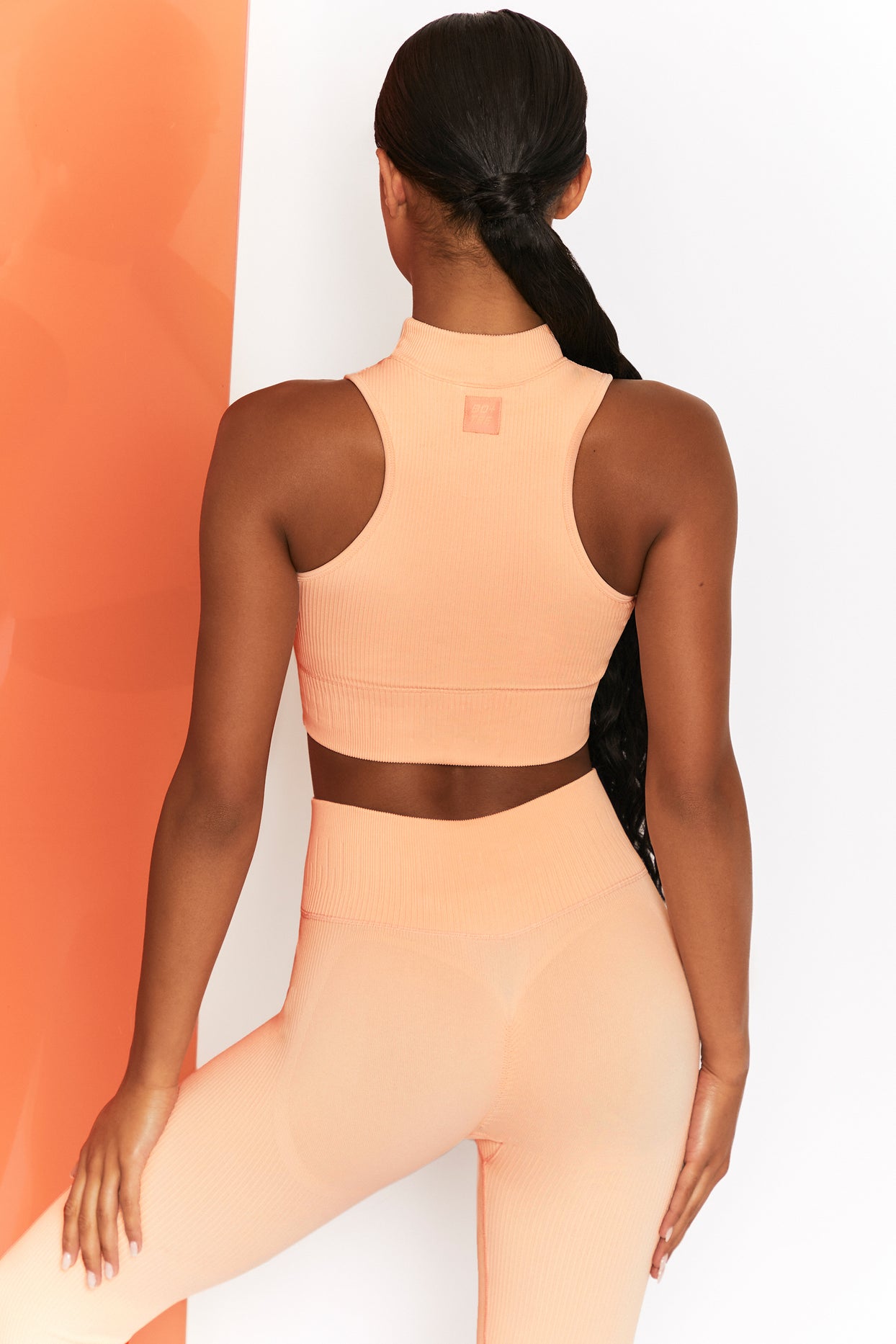 Miles Ahead Ribbed High Neck Crop Top in Peach