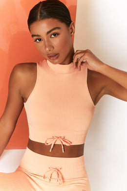 Miles Ahead Ribbed High Neck Crop Top in Peach